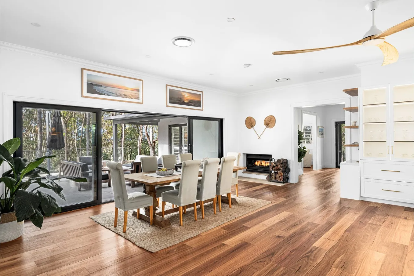 Dining room opening to the garden through sliding doors
