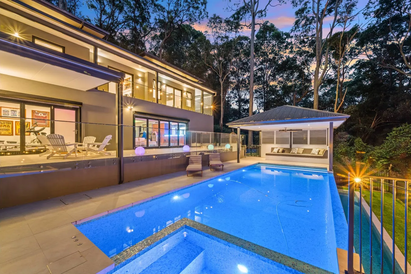 Pool terrace beside the home at dusk