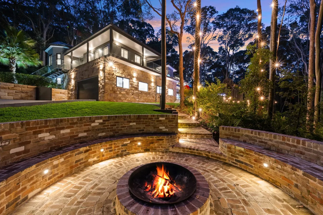 Sandstone fire pit terrace below the home