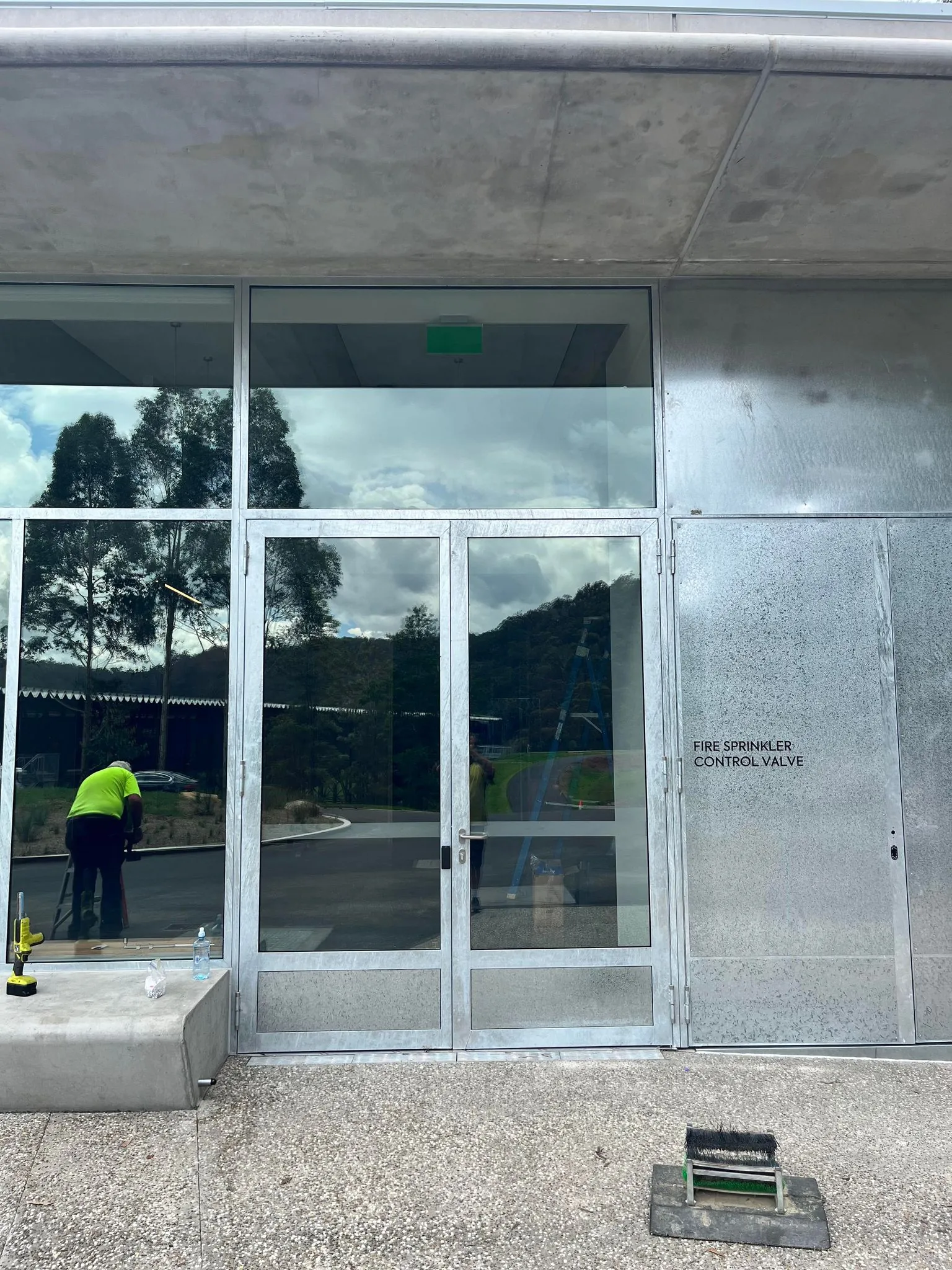 Glazed entry doors in a galvanised steel frame