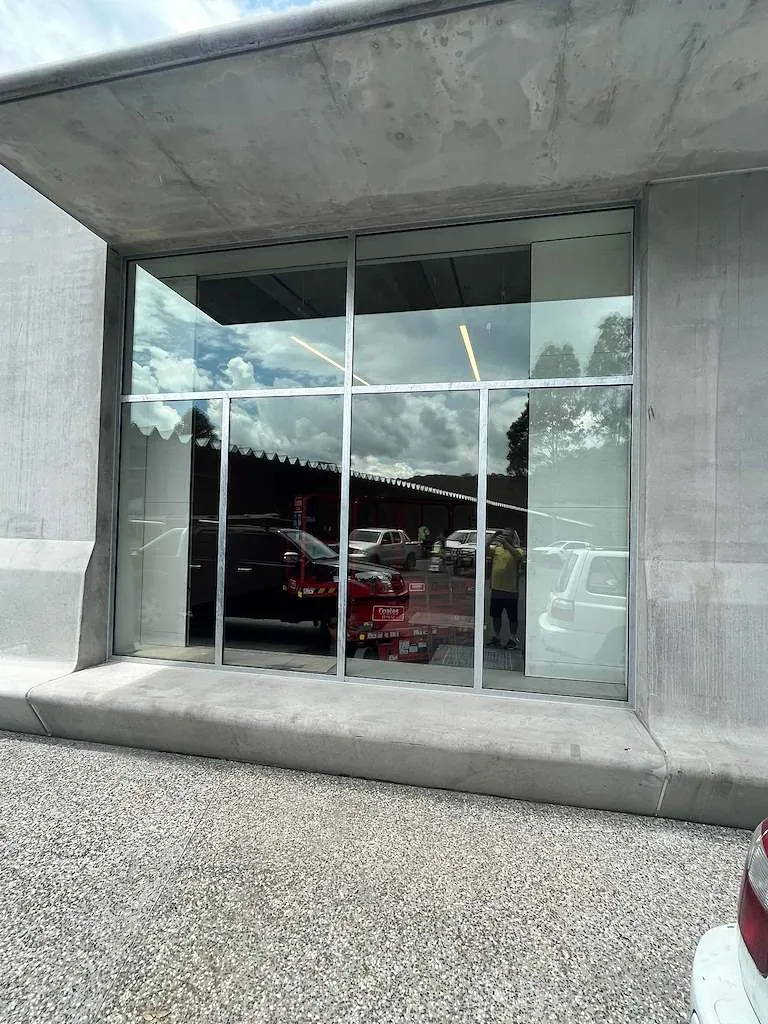 Fixed glazing set into the concrete facade