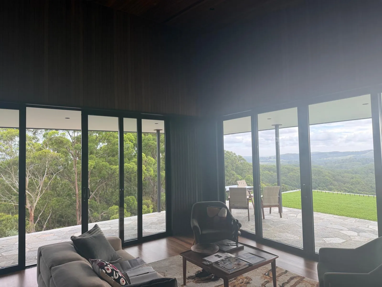 Living area opening to the terrace through full-height glazing